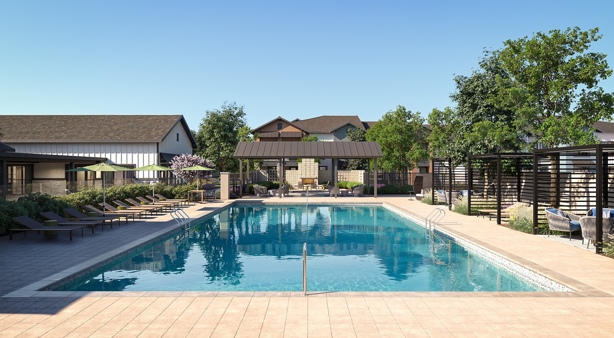 A large swimming pool surrounded by a wooden deck and lounge chairs.